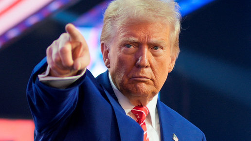 FILE PHOTO: U.S. President-elect Donald Trump gestures at Turning Point USA's AmericaFest in Phoenix, Arizona, U.S., December 22, 2024. REUTERS/Cheney Orr/File Photo